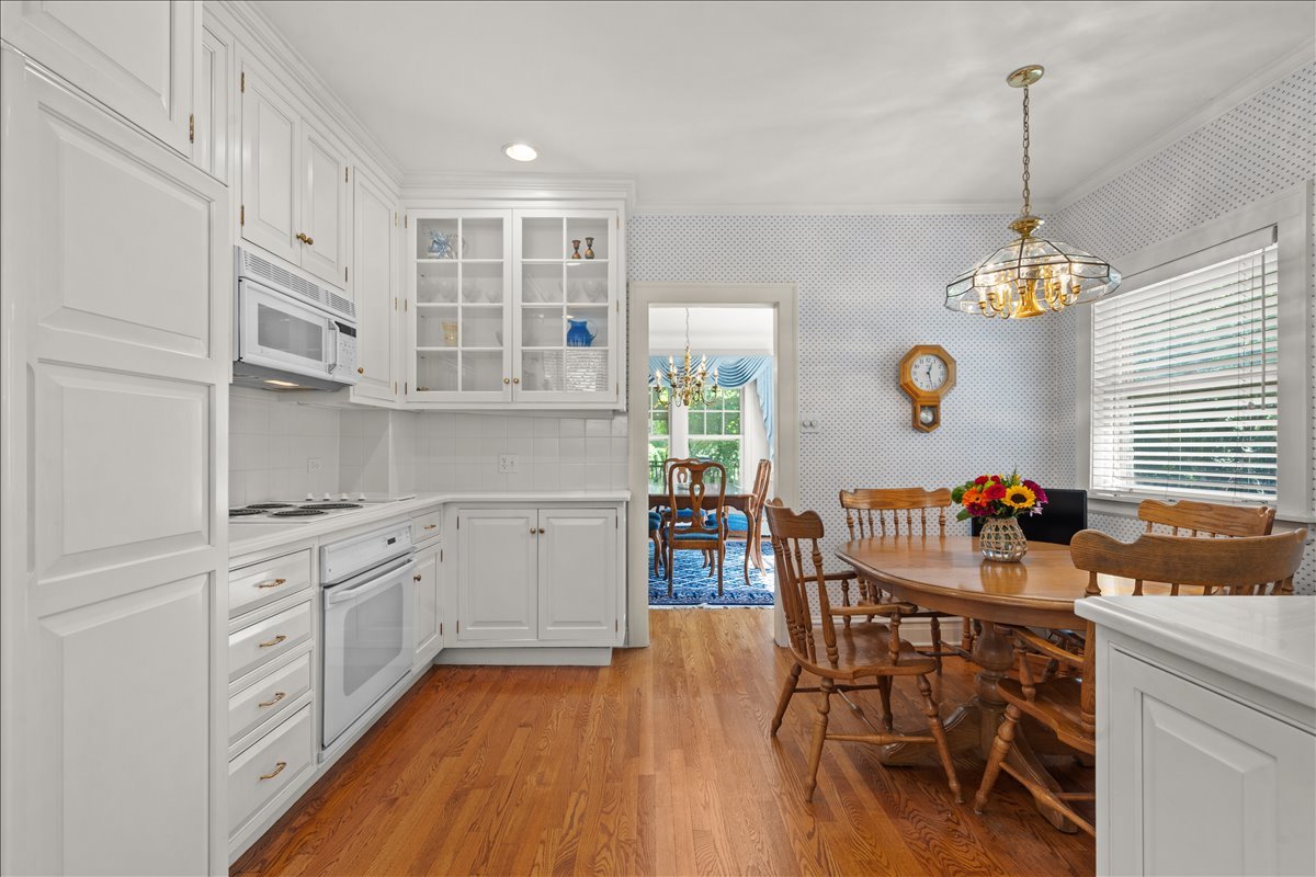 27 Logan Terrace Golf, IL 60029 - Photo 10 of 30 a kitchen that has a lot of cabinets a sink and appliances