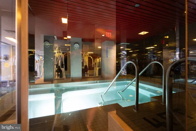 a view of a swimming pool with chairs