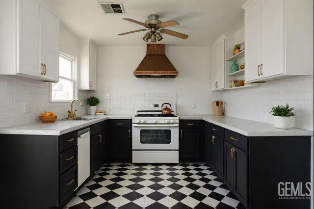 a bathroom with a sink a toilet and a window