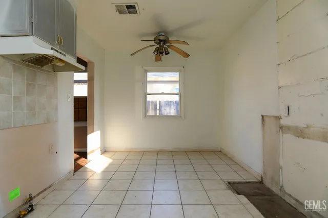a kitchen with a sink a stove and cabinets