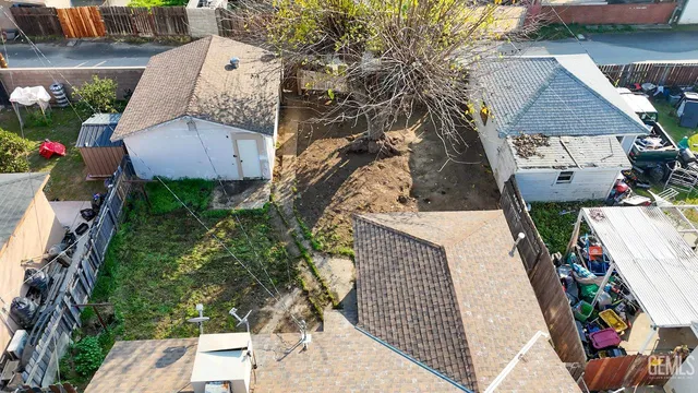 an aerial view of a house with outdoor space