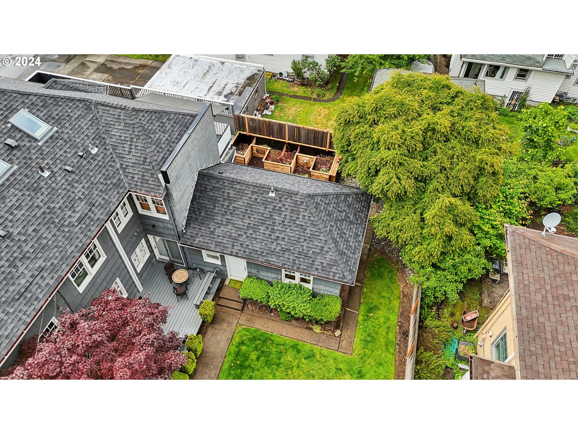 1510 Northeast 19th Avenue, Unit 4 Portland, OR 97232 - Photo 31 of 39 a aerial view of a house with a garden