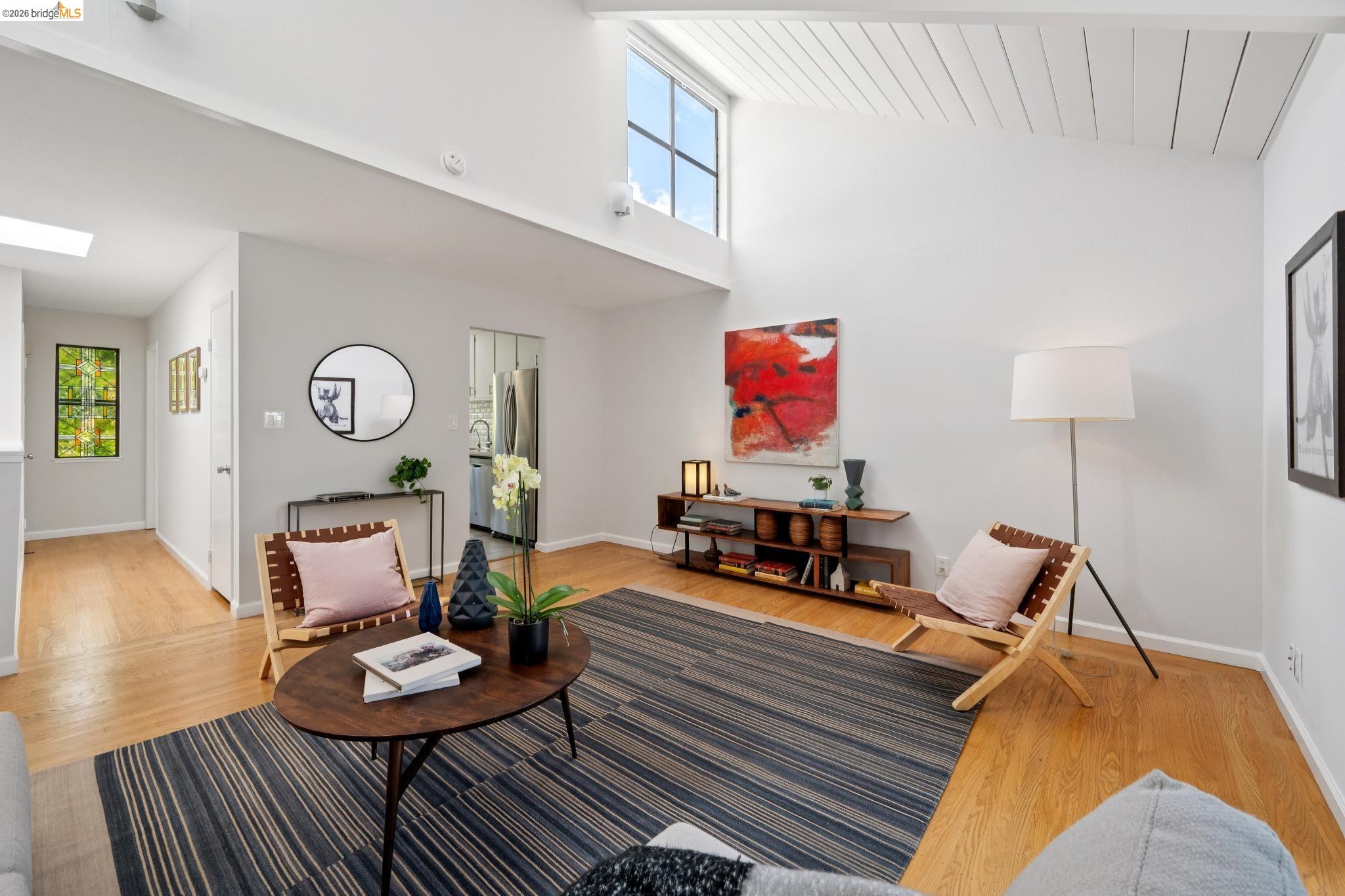 1340 Henry Street Berkeley, CA 94709 - Photo 11 of 52 Vaulted ceiling with exposed wood beams, high window, and skylight
