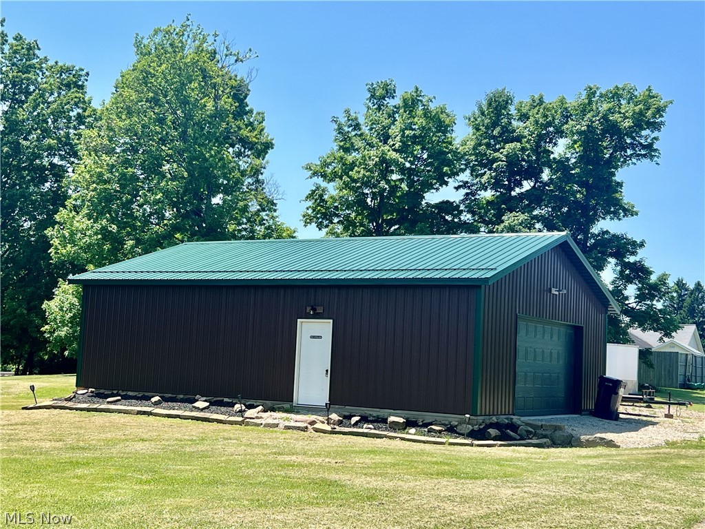39589 National Road Bethesda, OH 43719 - Photo 33 of 35 View of shed / structure with a garage and a yard