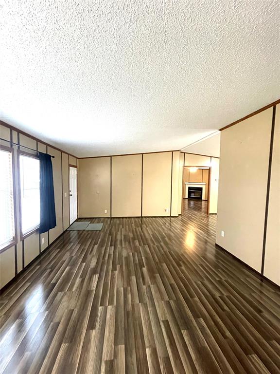 440 Ballman Road Riesel, TX 76682 - Photo 15 of 32 a view of empty room with wooden floor and fan