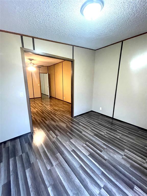 440 Ballman Road Riesel, TX 76682 - Photo 18 of 32 a view of a room with wooden floor