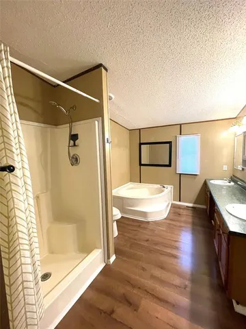 a bathroom with a bathtub and a shower