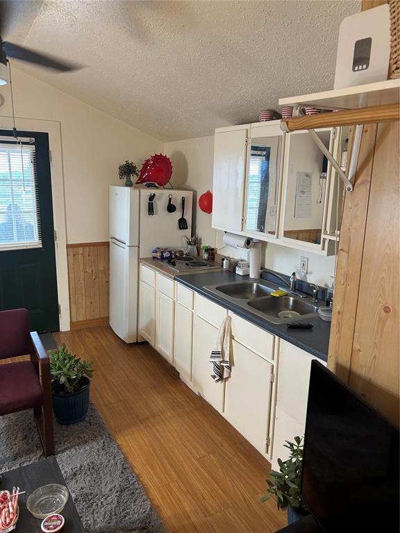 440 Ballman Road Riesel, TX 76682 - Photo 27 of 32 a kitchen with sink refrigerator and stove