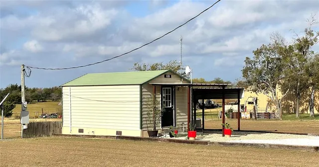 a view of a house with basketball court