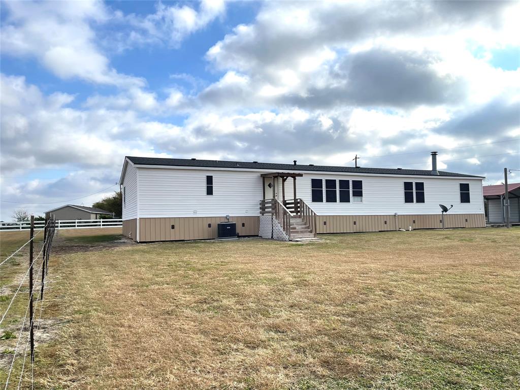 440 Ballman Road Riesel, TX 76682 - Photo 7 of 32 a view of a house with a yard