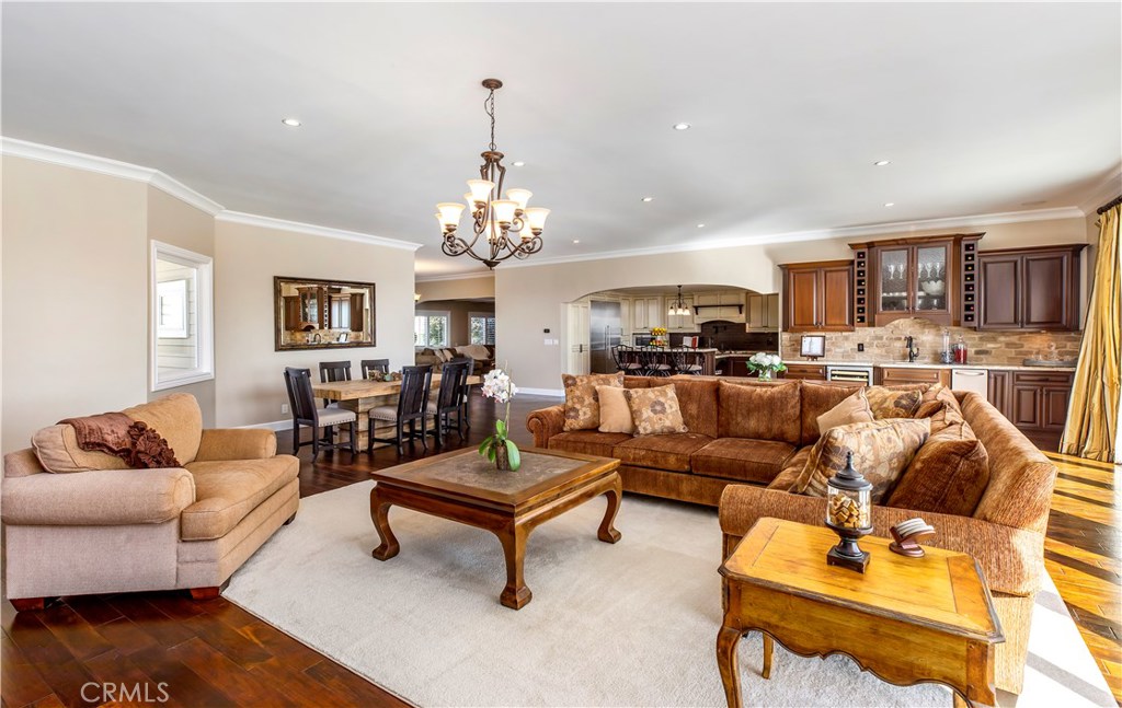 12822 Periwinkle Drive North Tustin, CA 92705 - Photo 12 of 36 a living room with furniture and a chandelier