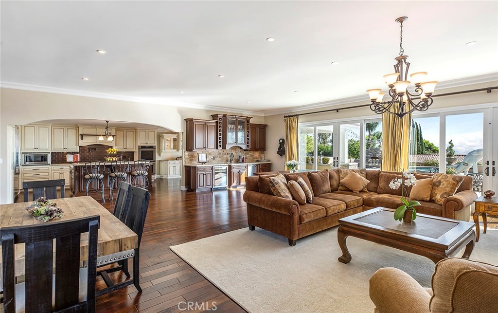 12822 Periwinkle Drive North Tustin, CA 92705 - Photo 13 of 36 a living room with furniture and a chandelier