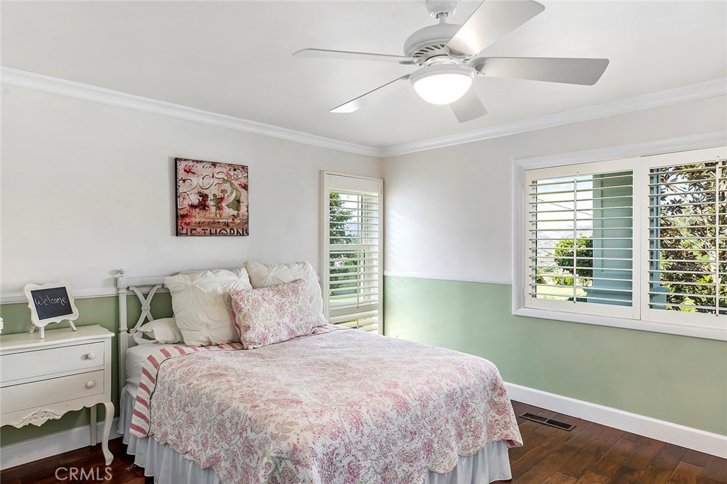 12822 Periwinkle Drive North Tustin, CA 92705 - Photo 22 of 36 a bedroom with a large bed and a window
