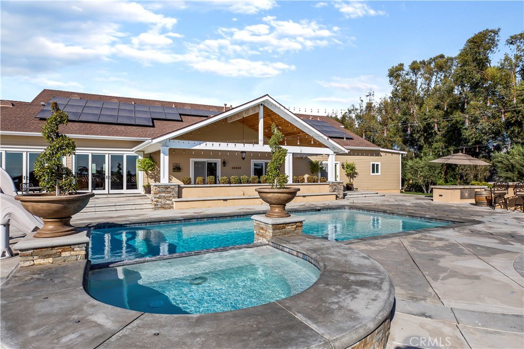 12822 Periwinkle Drive North Tustin, CA 92705 - Photo 26 of 36 a view of house with swimming pool and sitting area
