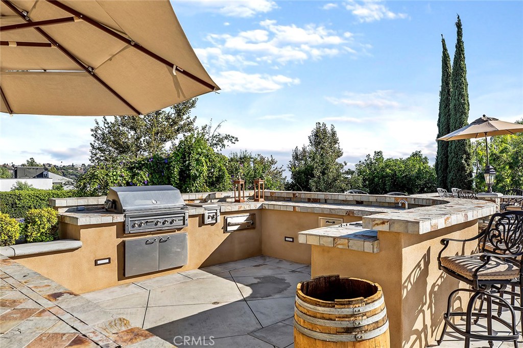 12822 Periwinkle Drive North Tustin, CA 92705 - Photo 27 of 36 a view of a dinning table and chairs in the patio