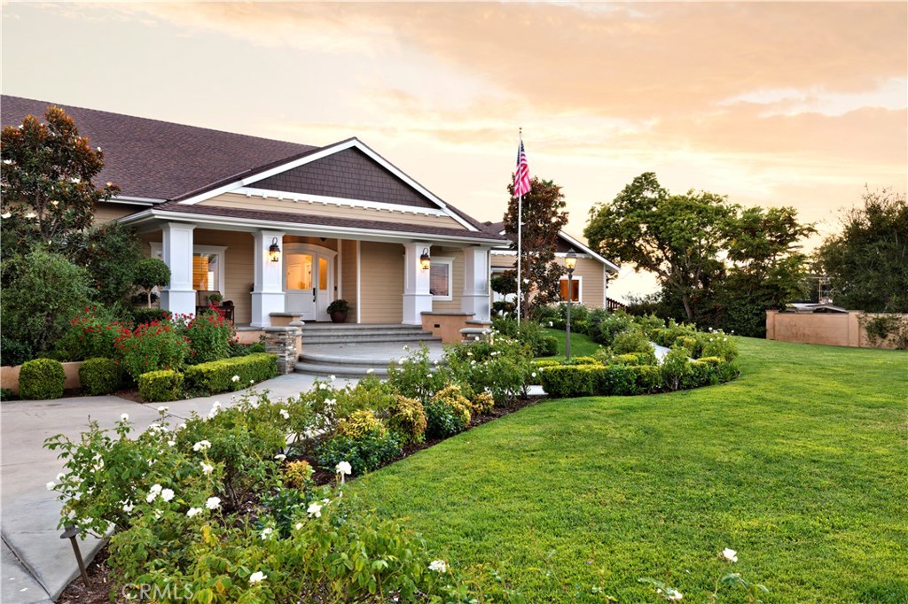 12822 Periwinkle Drive North Tustin, CA 92705 - Photo 3 of 36 a front view of a house with a yard