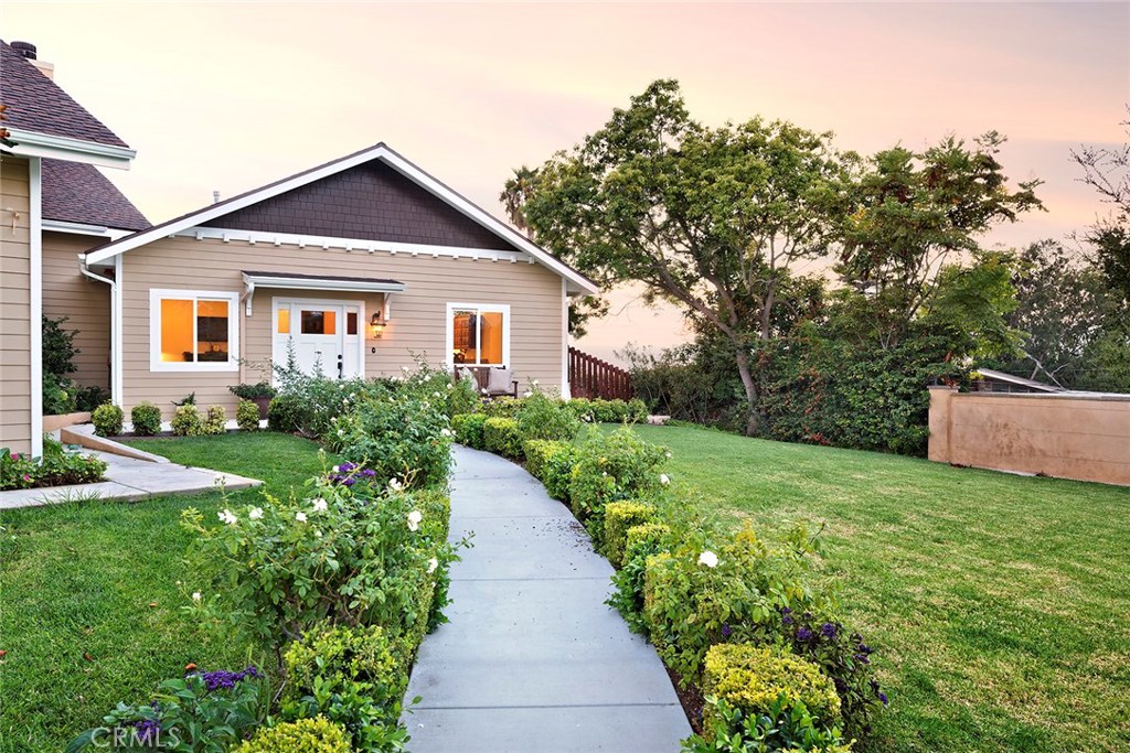 12822 Periwinkle Drive North Tustin, CA 92705 - Photo 32 of 36 a front view of a house with a yard
