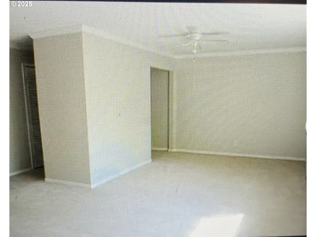 a kitchen with a stove and a refrigerator