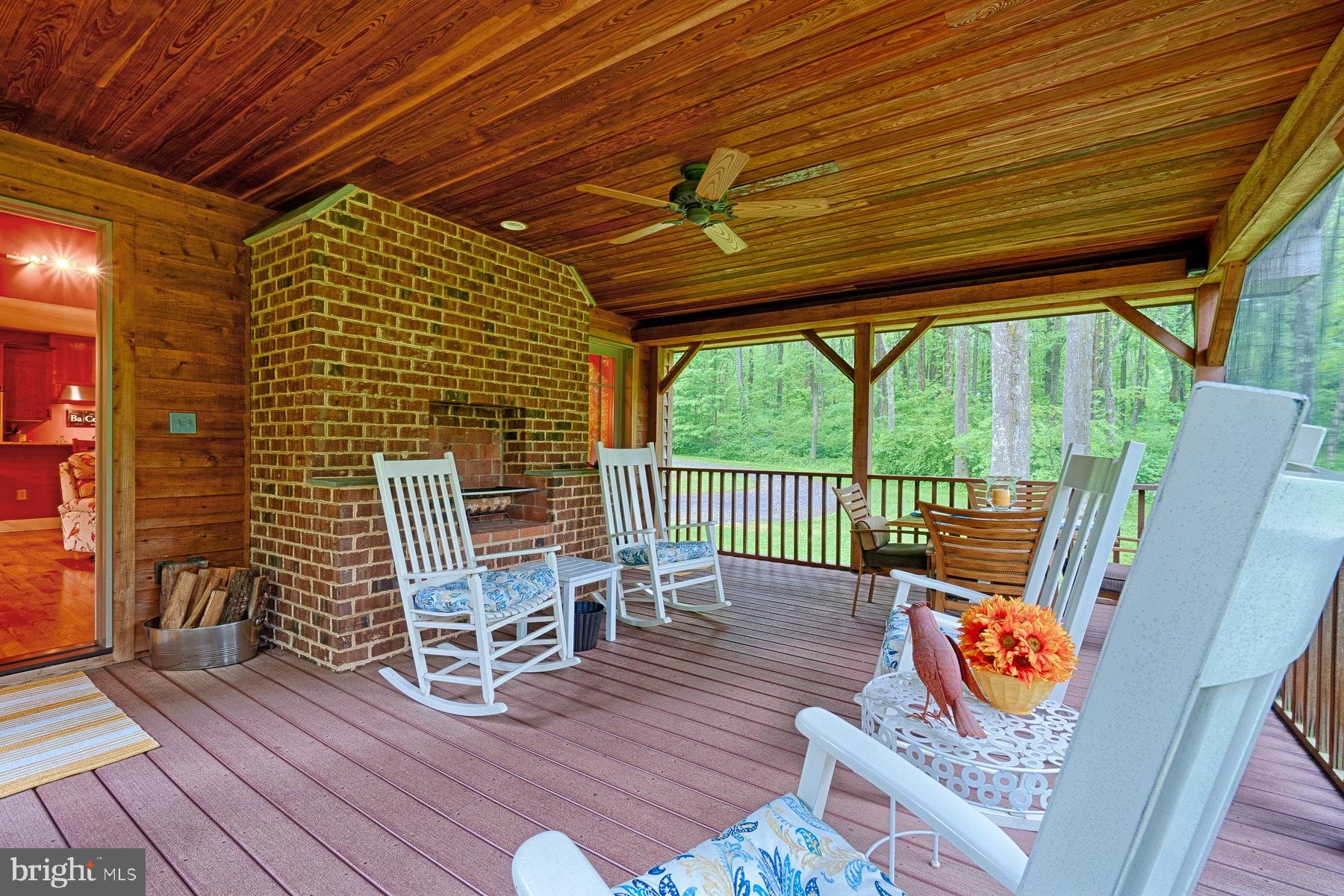 20769 Blue Ridge Mountain Road Paris, VA 20130 - Photo 49 of 63 Amazing screened in porch w/cooking fireplace