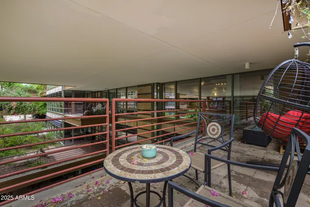 an outdoor space with furniture and garden