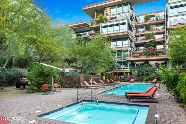 an outdoor space with patio furniture and potted plants