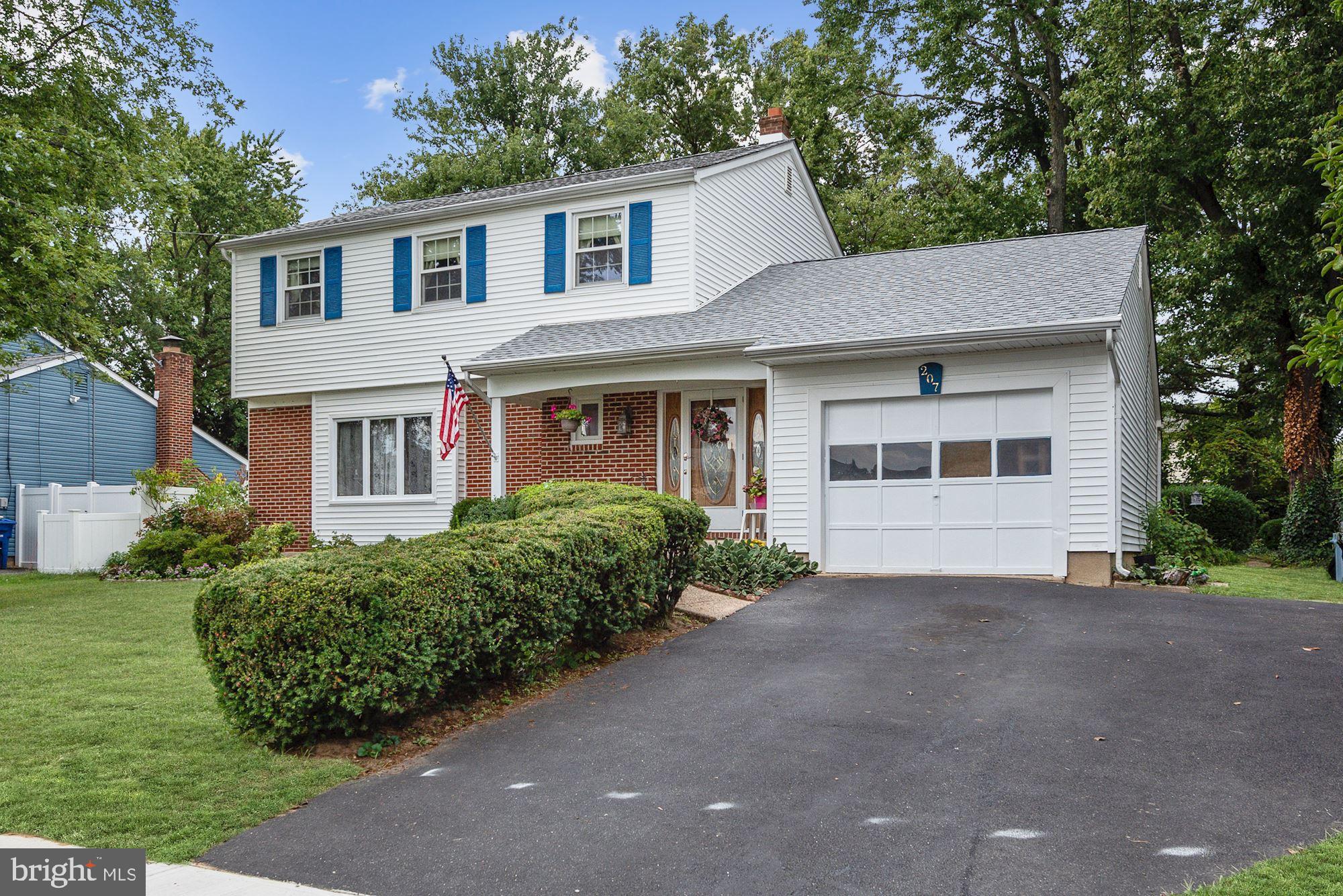 207 Regency Road Edgewater Park, NJ 08010 - Photo 2 of 36 a front view of a house with a garden