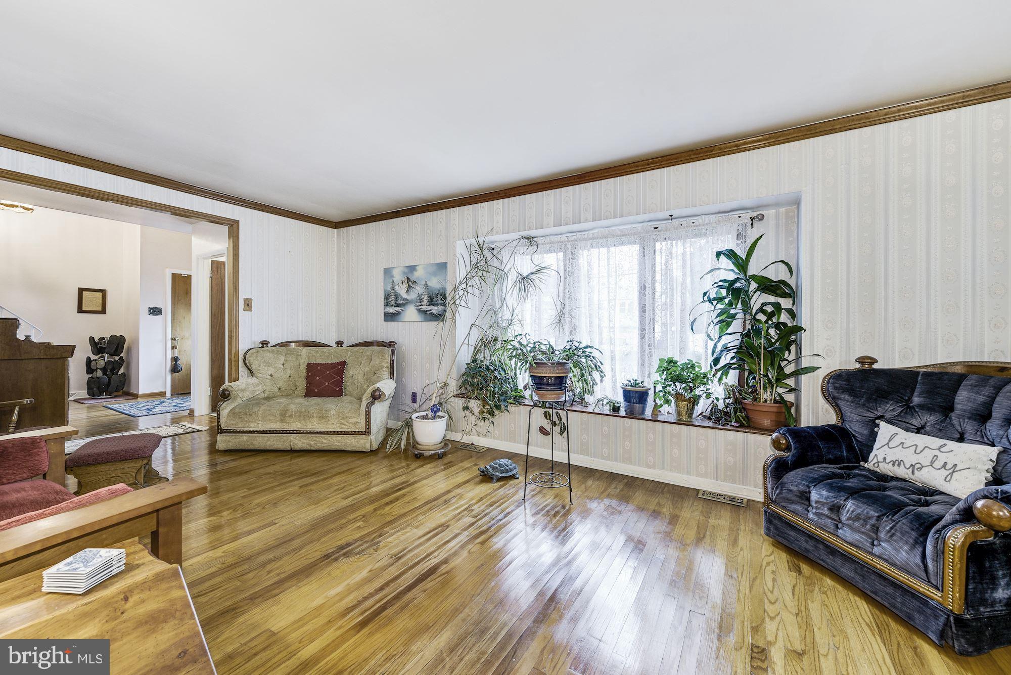207 Regency Road Edgewater Park, NJ 08010 - Photo 15 of 36 a living room with furniture and a large window
