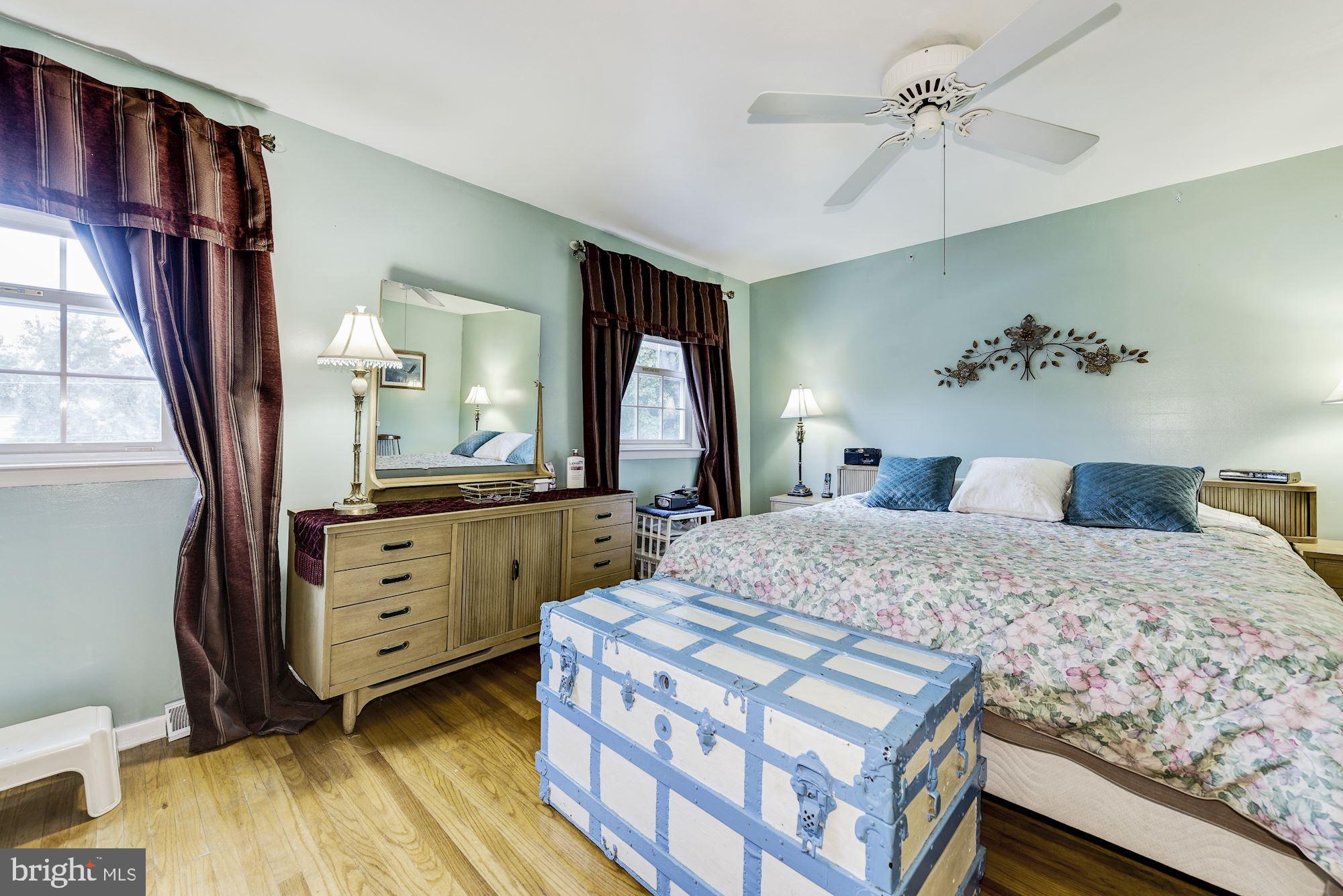 207 Regency Road Edgewater Park, NJ 08010 - Photo 27 of 36 a bedroom with a bed and a mirror on dresser