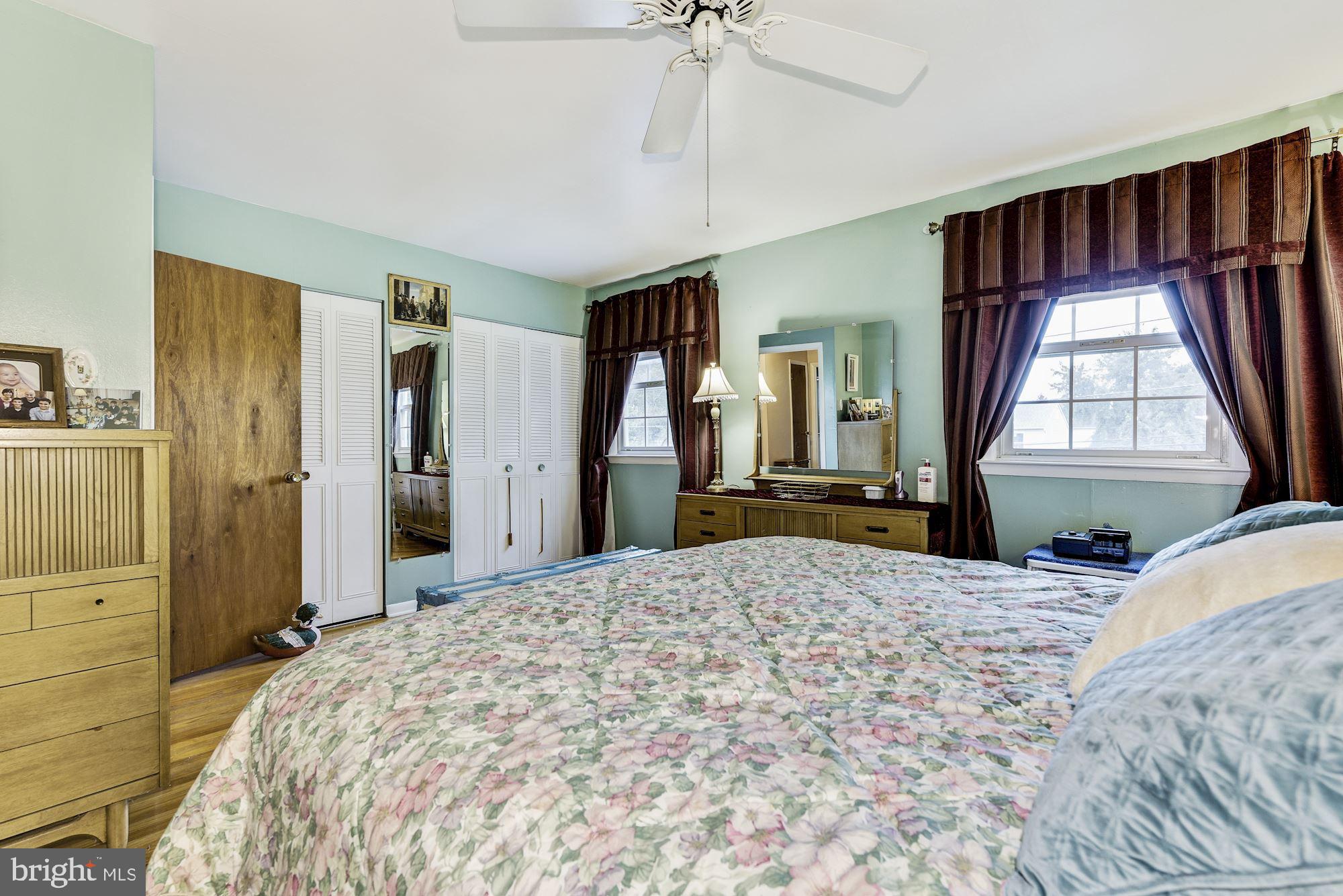 207 Regency Road Edgewater Park, NJ 08010 - Photo 29 of 36 a bedroom with a bed closet and a window