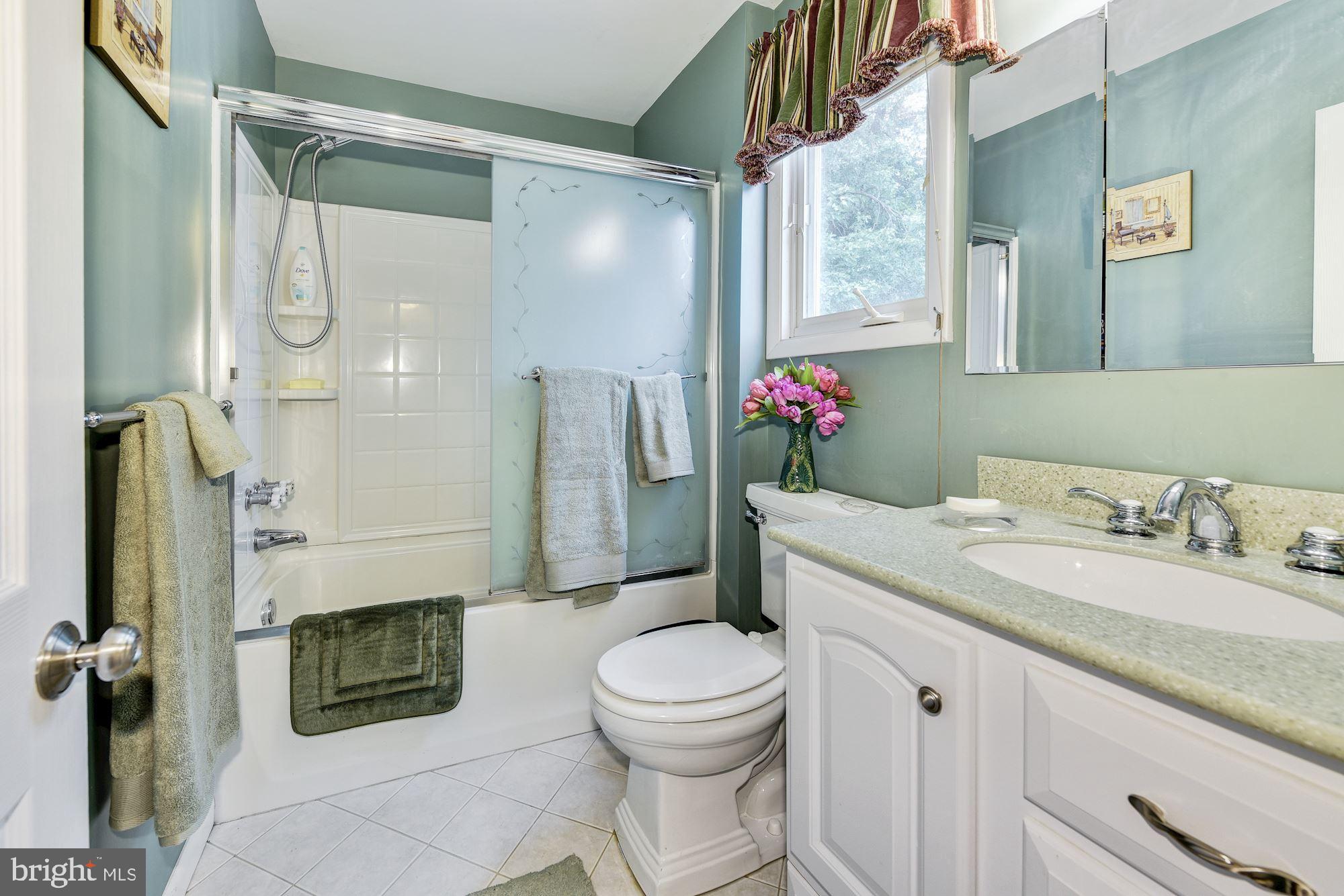 207 Regency Road Edgewater Park, NJ 08010 - Photo 30 of 36 a bathroom with a granite countertop sink toilet and shower