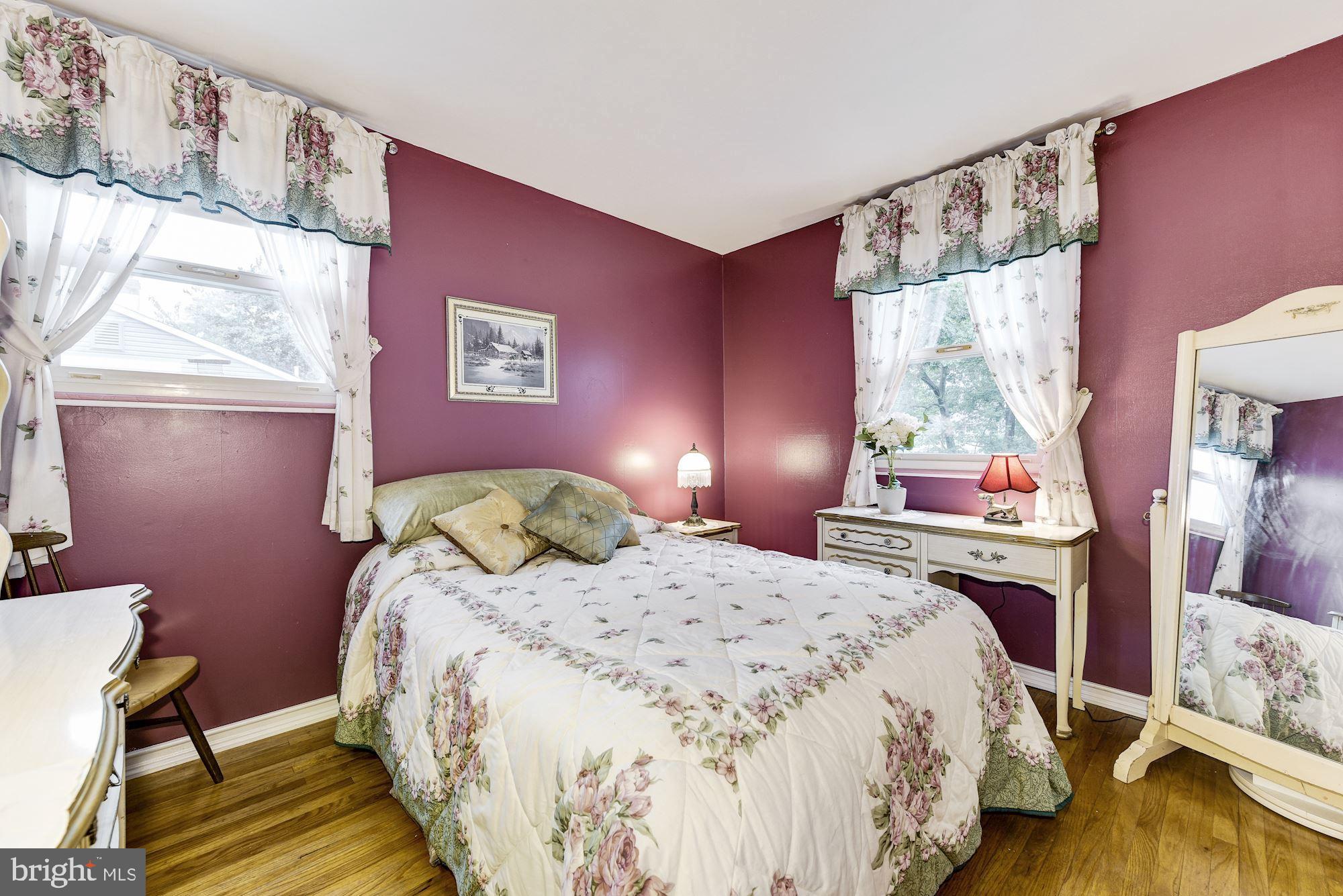 207 Regency Road Edgewater Park, NJ 08010 - Photo 32 of 36 a bedroom with a bed and wooden floor
