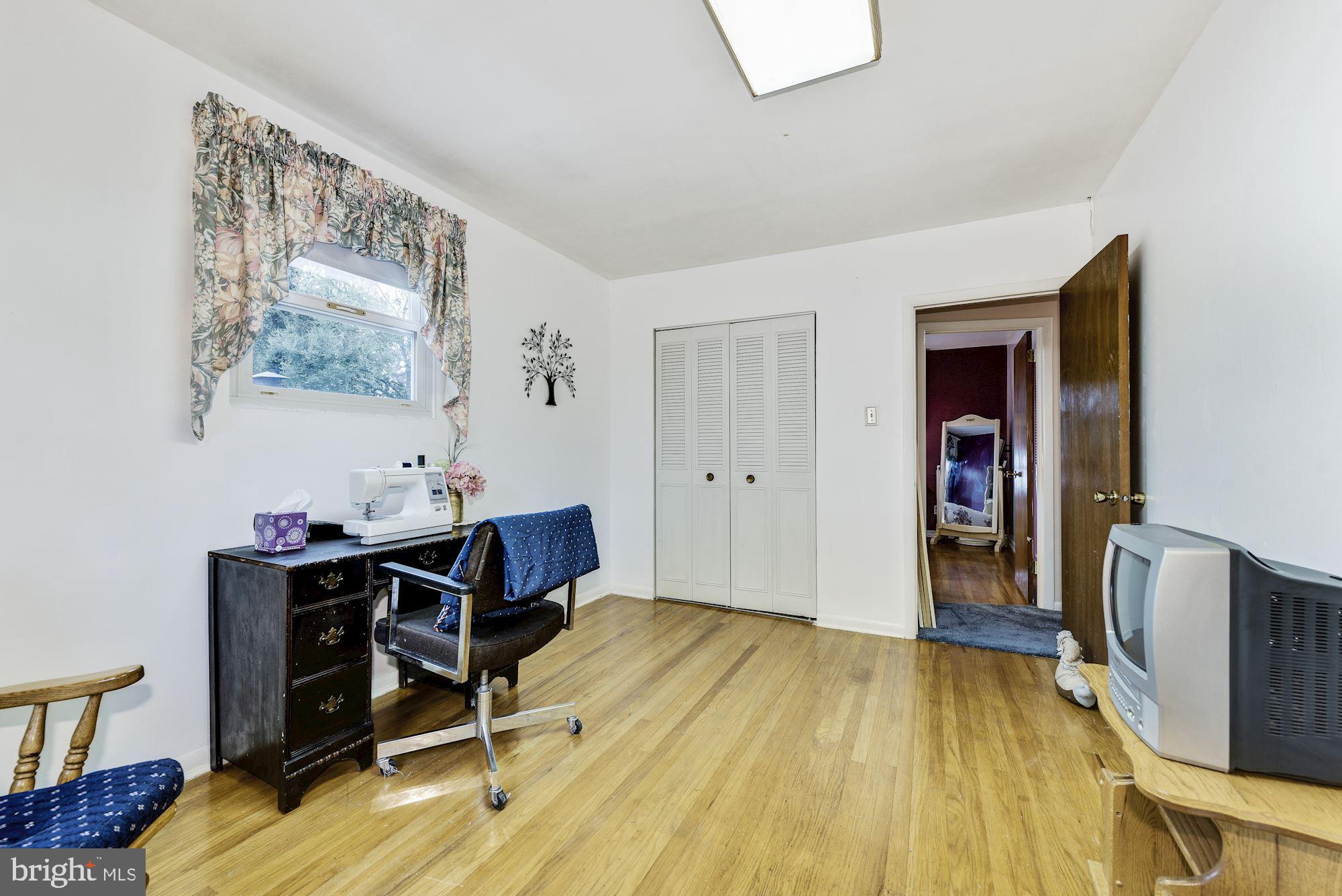 207 Regency Road Edgewater Park, NJ 08010 - Photo 34 of 36 a view of a workspace with furniture and wooden floor