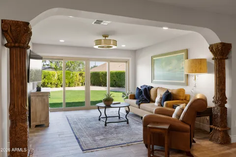 a living room with furniture and a large window