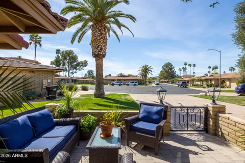 a view of a chairs and table in the patio