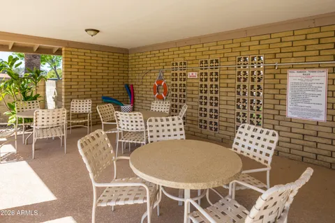 a swimming pool that is in front of a building