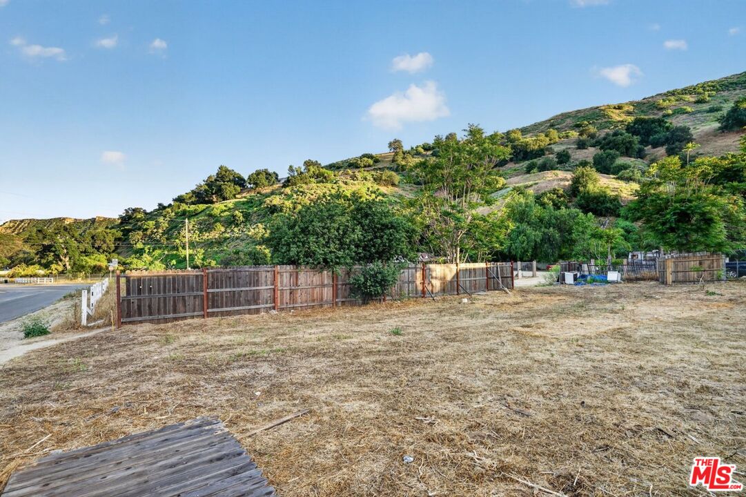 0 Castaic Road Castaic, CA 91384 - Photo 2 of 34 a backyard of a house with lots of green space and trees