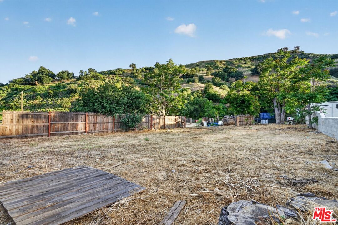0 Castaic Road Castaic, CA 91384 - Photo 4 of 34 a backyard of a house with lots of green space and trees