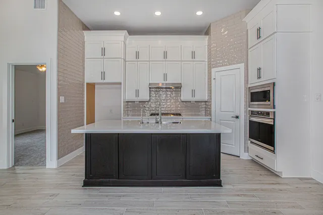 a view of kitchen with wooden floor