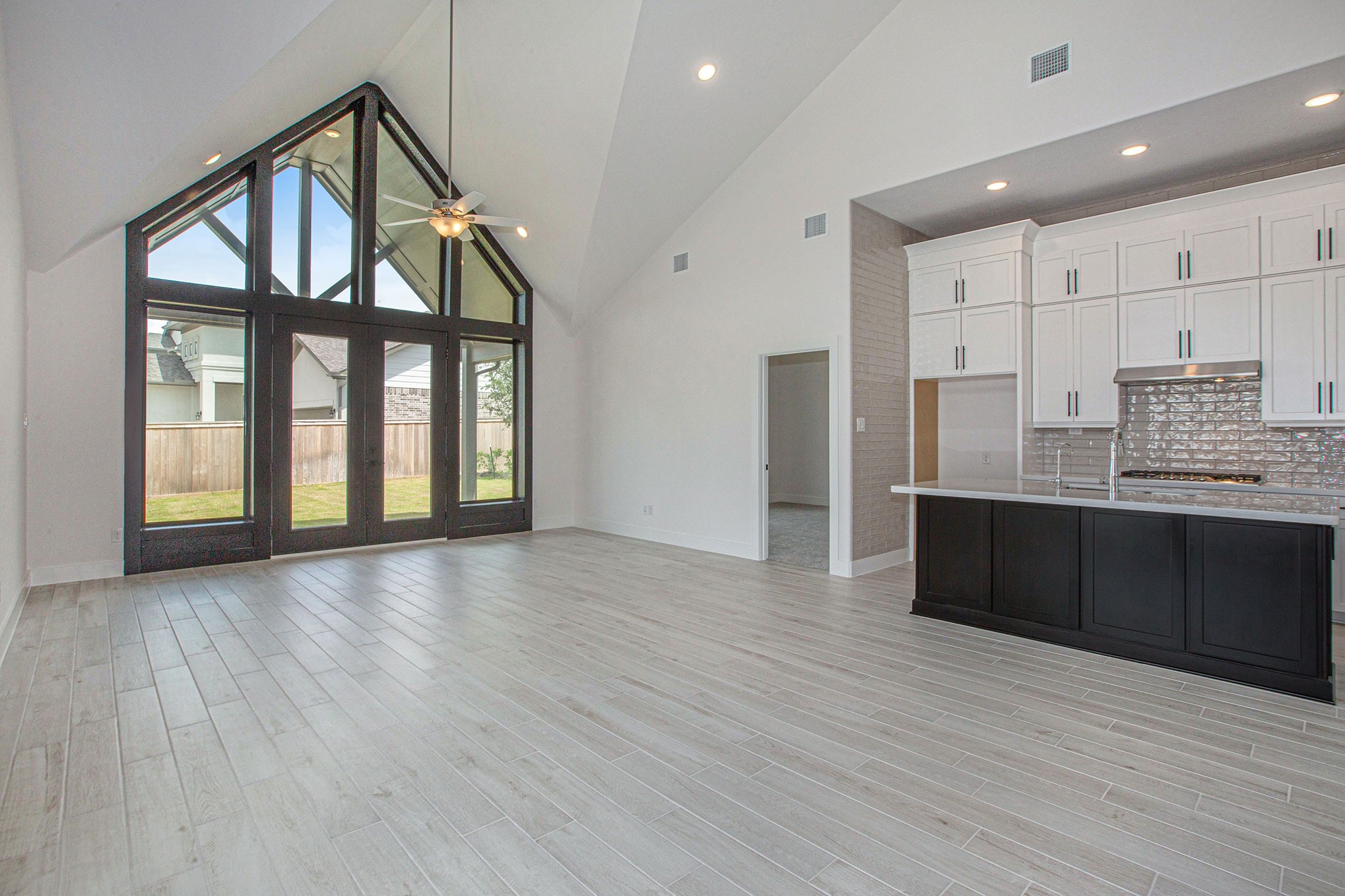 15018 Bonham Shore Drive Cypress, TX 77433 - Photo 13 of 31 a view of an empty room with window and wooden floor