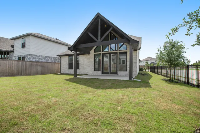 a front view of a house with yard