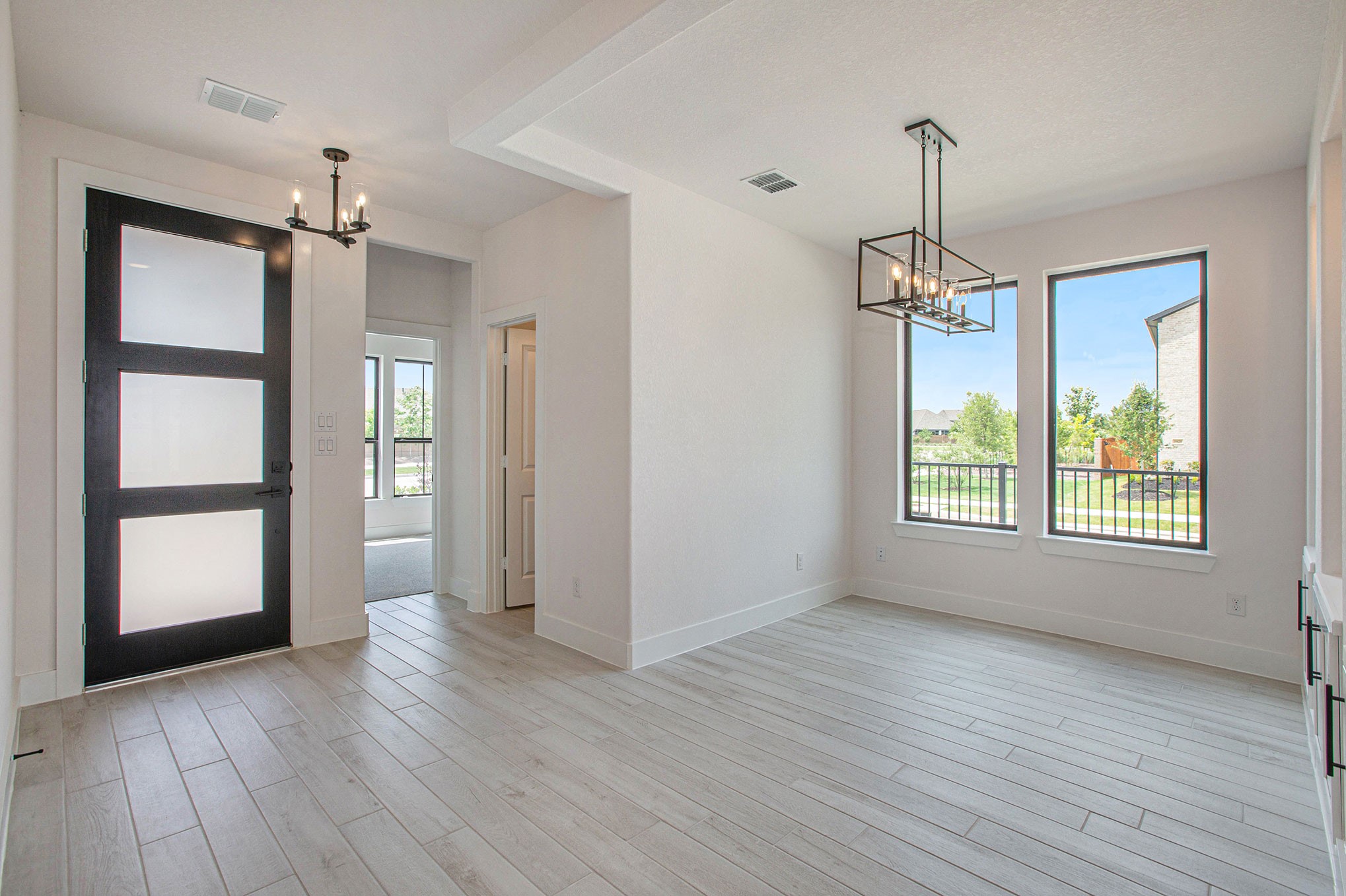 15018 Bonham Shore Drive Cypress, TX 77433 - Photo 3 of 31 wooden floor in an empty room with a window