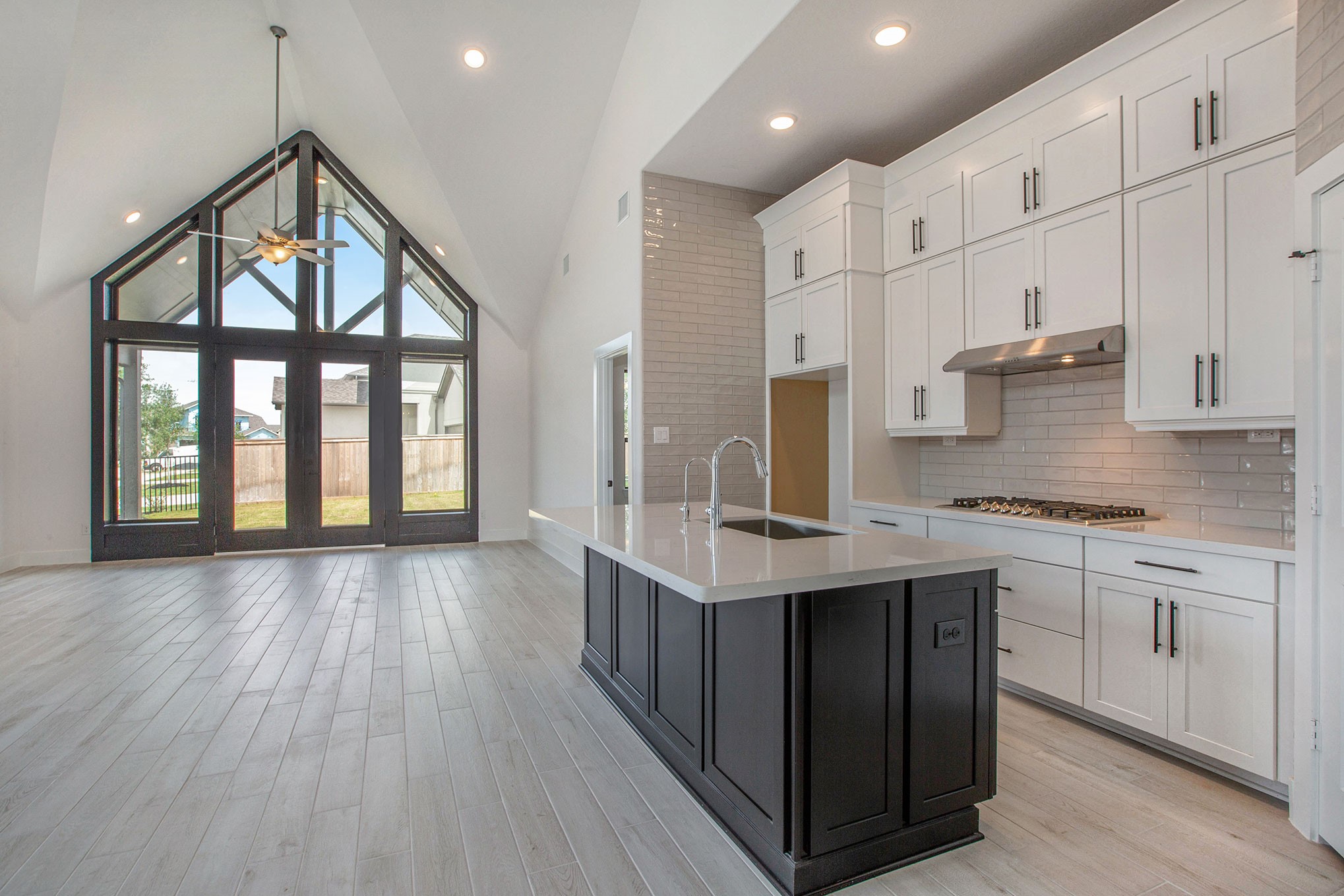 15018 Bonham Shore Drive Cypress, TX 77433 - Photo 9 of 31 a kitchen with stainless steel appliances granite countertop a stove and cabinets