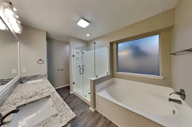 an empty room with ceiling fan and window