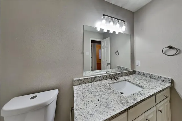 an empty room with a ceiling fan