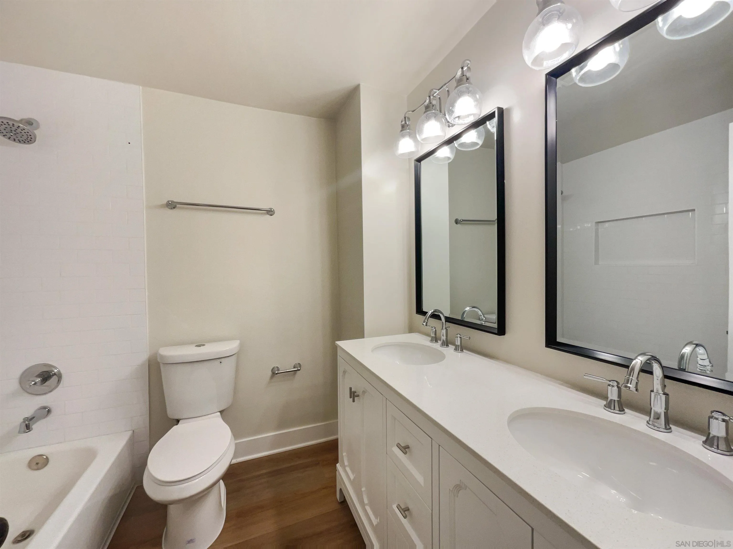 350 Whispering Brook Drive Vista, CA 92083 - Photo 14 of 17 a bathroom with a toilet sink and mirror