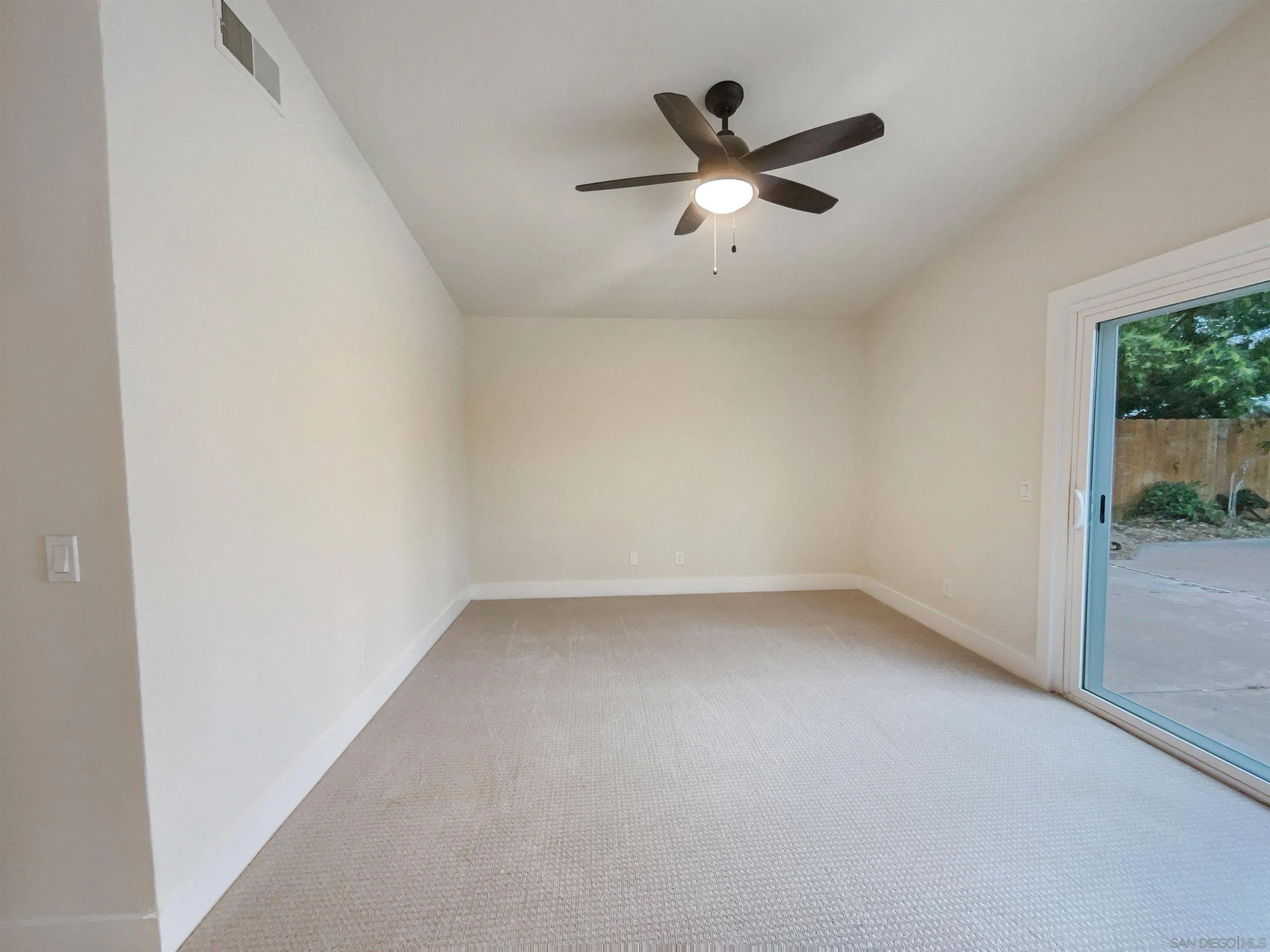 350 Whispering Brook Drive Vista, CA 92083 - Photo 15 of 17 an empty room with ceiling fan and window