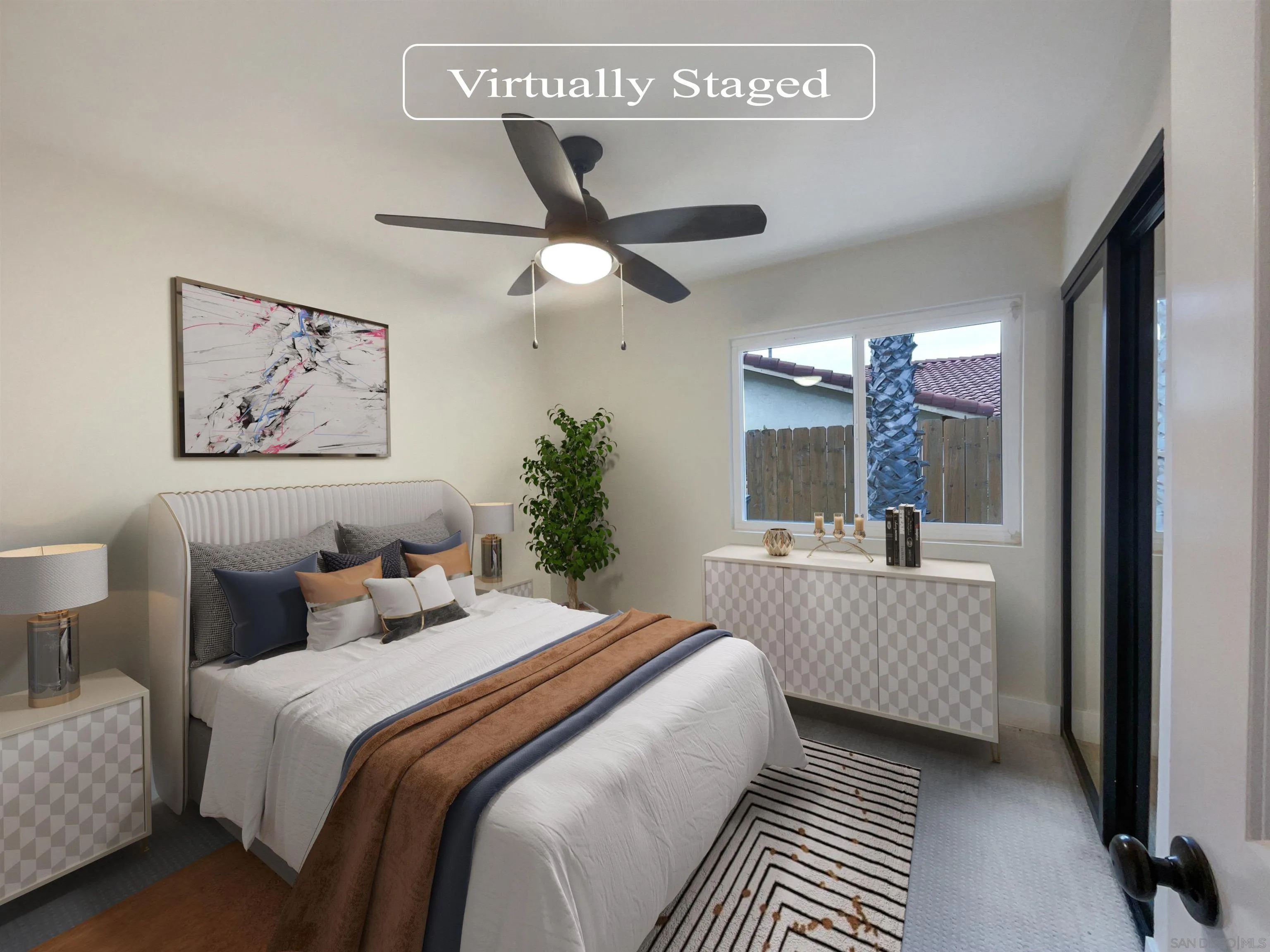 350 Whispering Brook Drive Vista, CA 92083 - Photo 4 of 17 a bedroom with a large bed and a chandelier