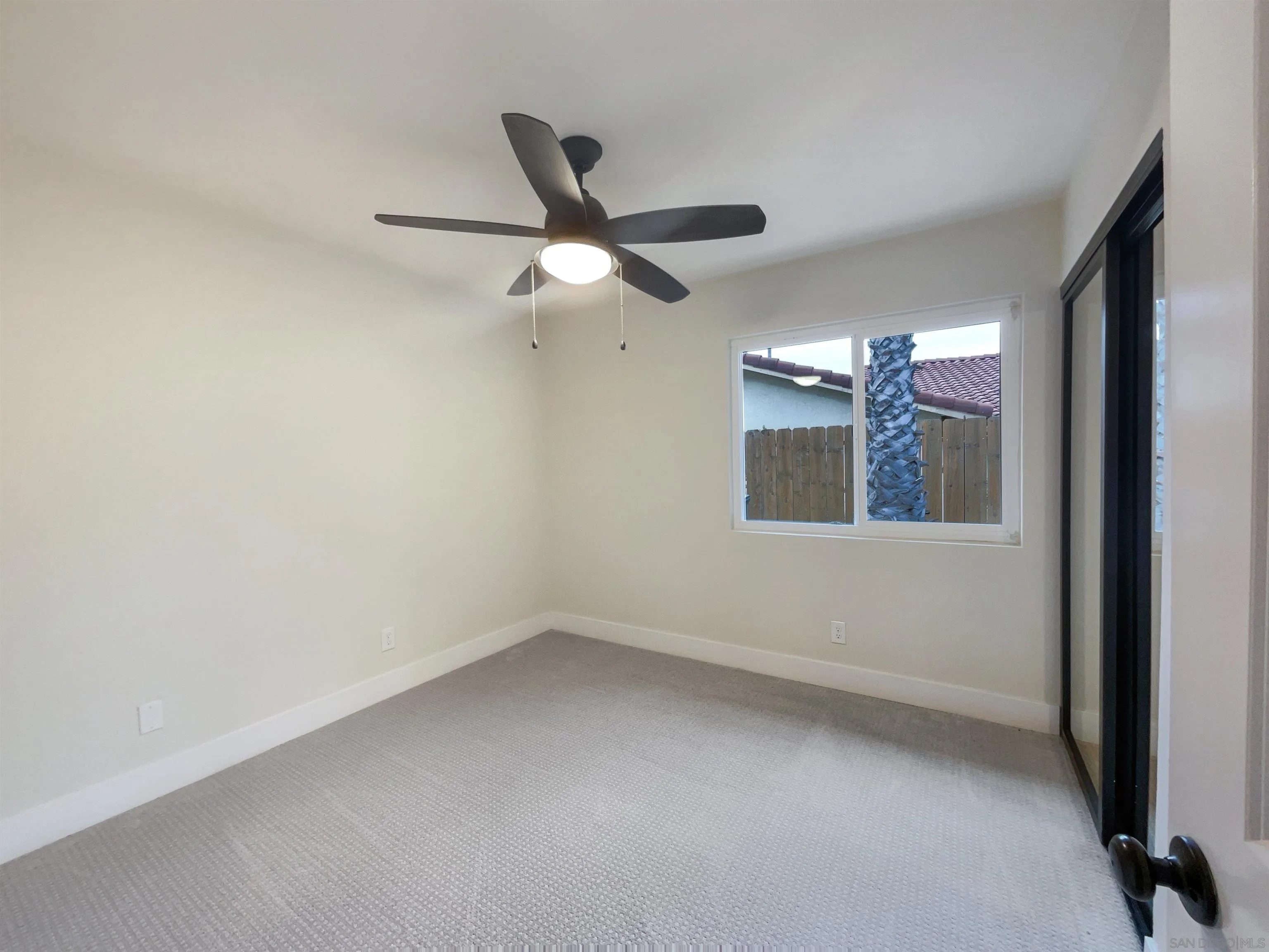 350 Whispering Brook Drive Vista, CA 92083 - Photo 5 of 17 a view of an empty room with a window
