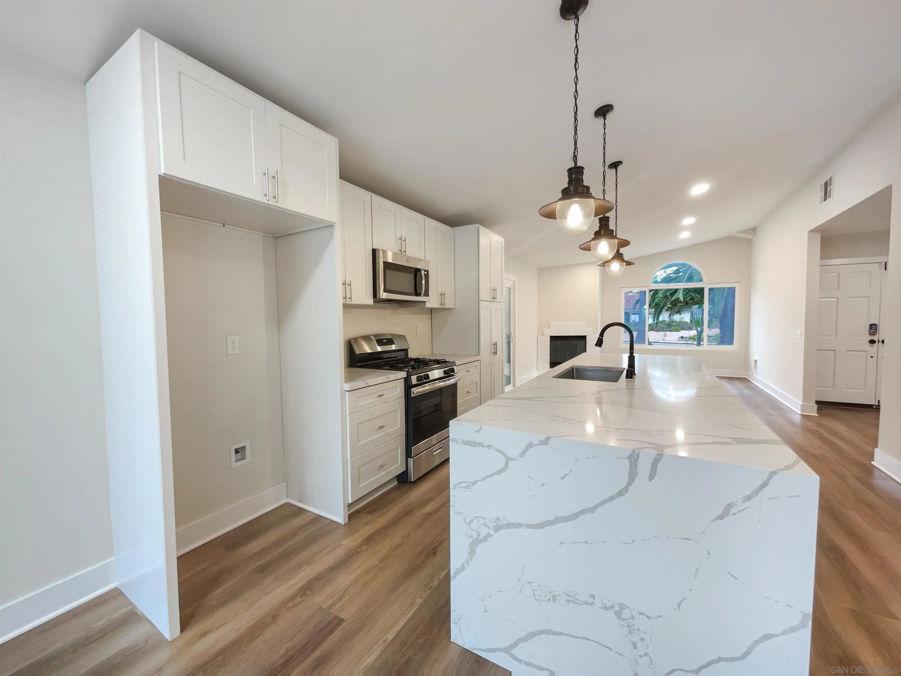 350 Whispering Brook Drive Vista, CA 92083 - Photo 6 of 17 a view of a kitchen with sink microwave and stove