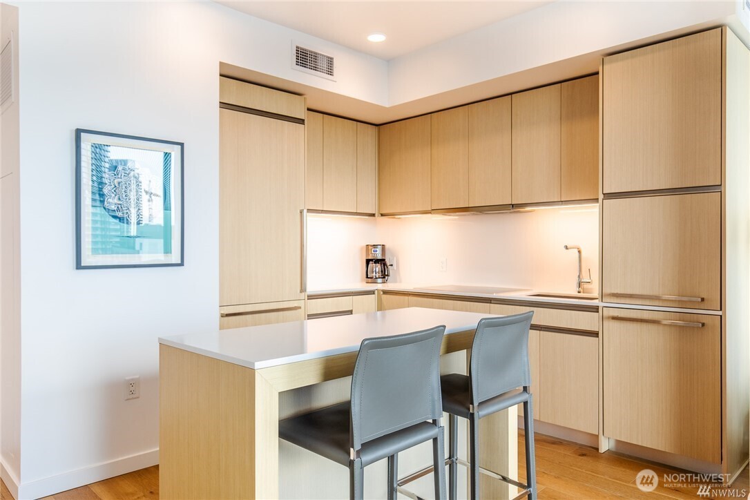 1808 Minor Avenue, Unit 905 Seattle, WA 98101 - Photo 2 of 33 a kitchen with a refrigerator and cabinets